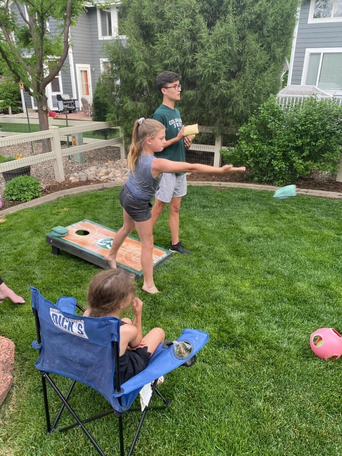 Corn hole is such a great backyard summer activity that all ages can play.