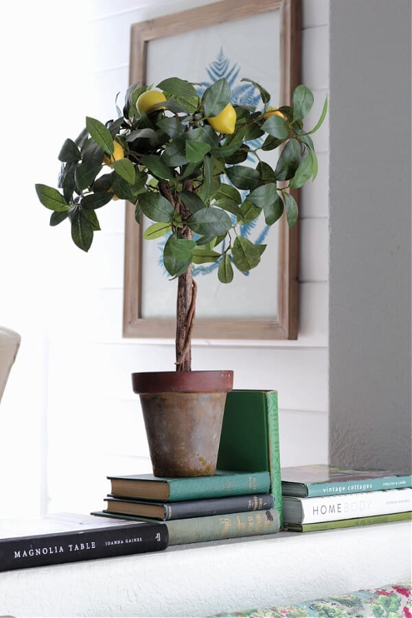 A lemon topiary and green books add that pop of color for Spring decor!