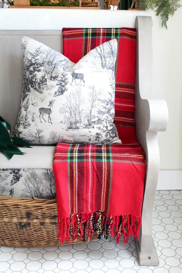 pillows and plaids make this Christmas decor cozy and collected.