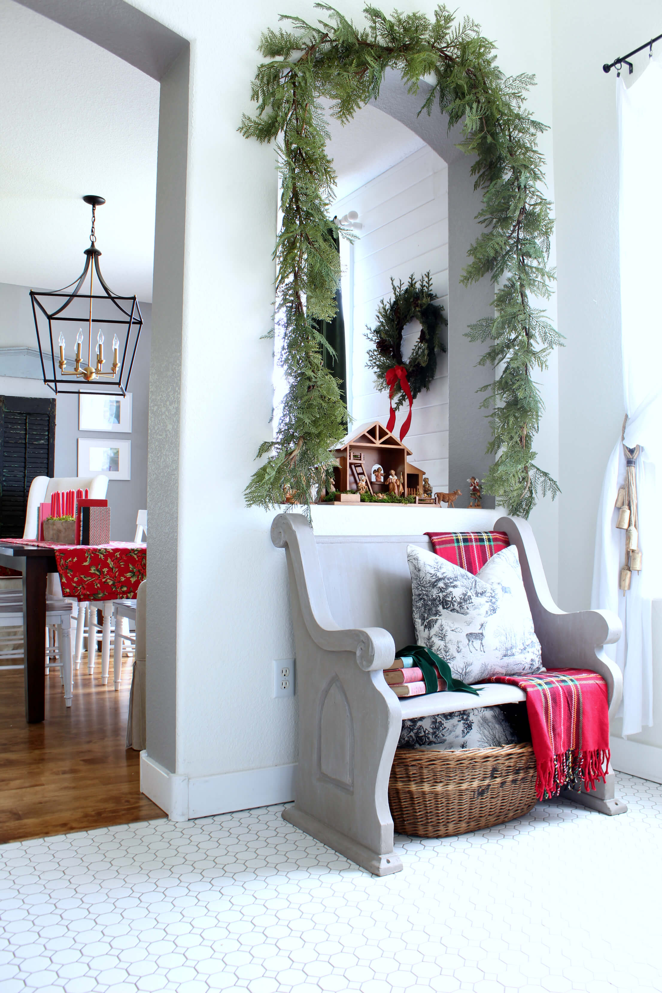 Our vintage pew is so much fun to decorate for Christmas.