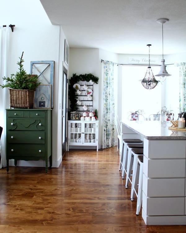 A cozy and eclectic kitchen dressed up for Christmas.
