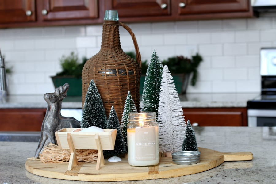 A sweet Christmas vignette with a fun mix of bottle brush trees.