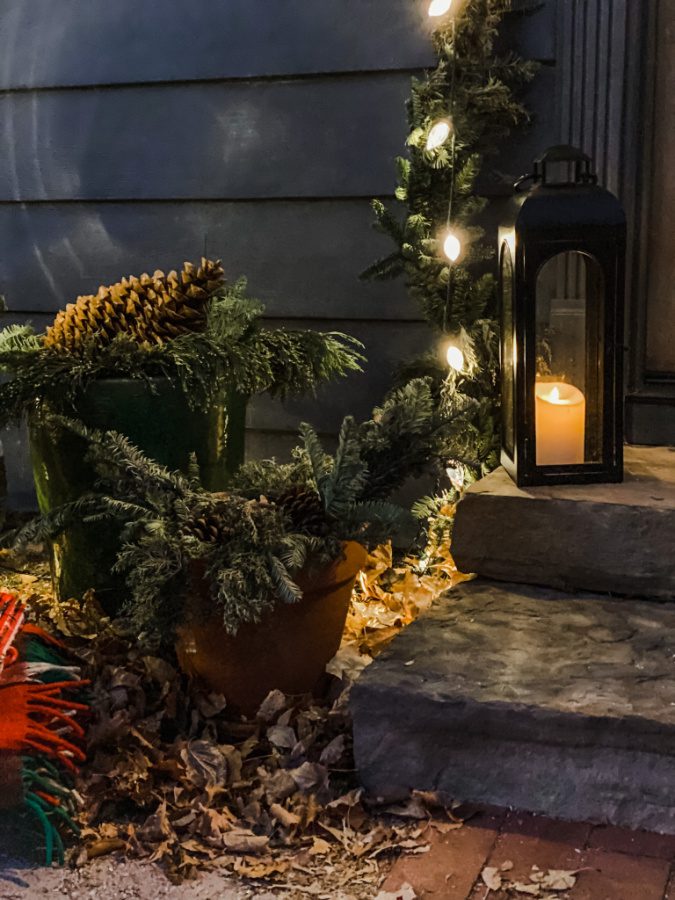 Lanterns, sugar pine cones and greenery offer a casual Christmas touch to our steps.