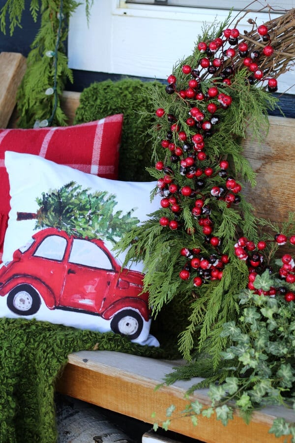 Cozy, collected and charming Christmas porch decor.