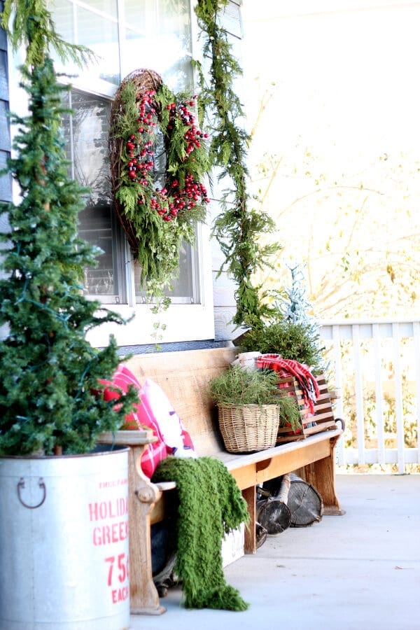 A cozy, collected and charming look at Christmas on the porch!