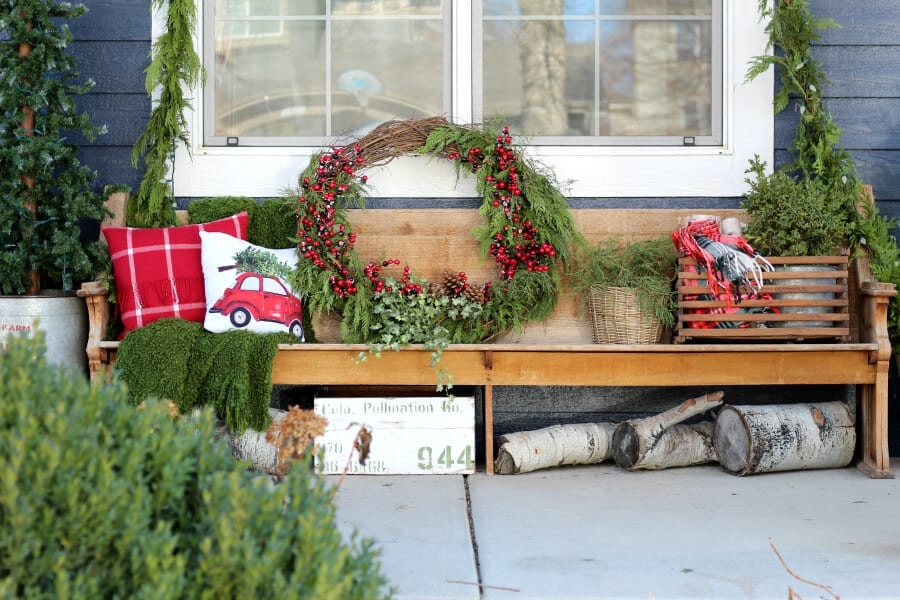 A lovely mix of old an new, red and green collected on a vintage pew.