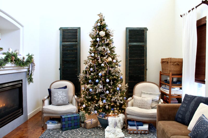 A cozy and eclectic family room with blue accents for Christmas.