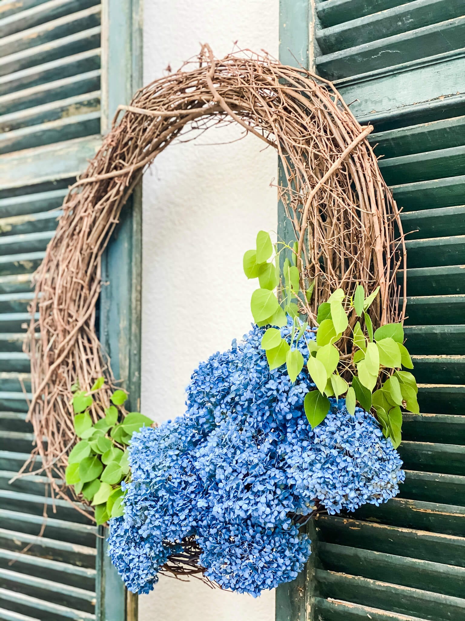 Make this blue hydrangea wreath in just minutes using spray paint!