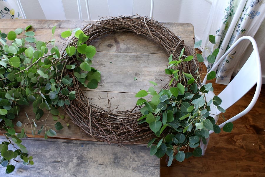 Using natural elements to create a fall farmhouse wreath.