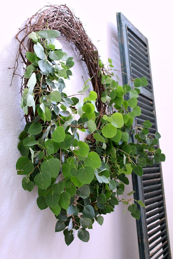 Making a large DIY Fall farmhouse wreath with aspen leaves.