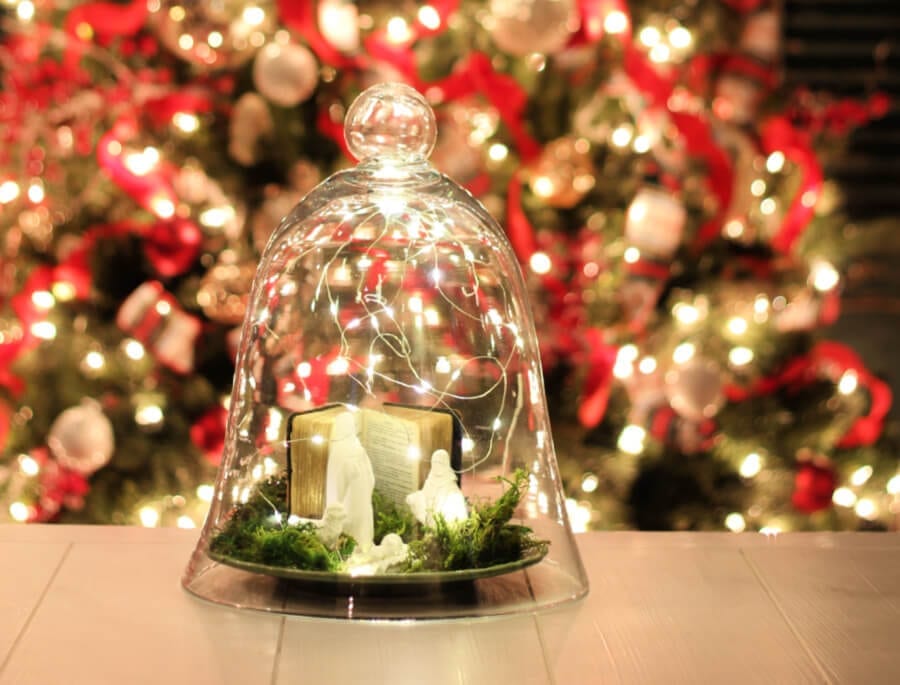 glass cloche with fairy lights and nativity