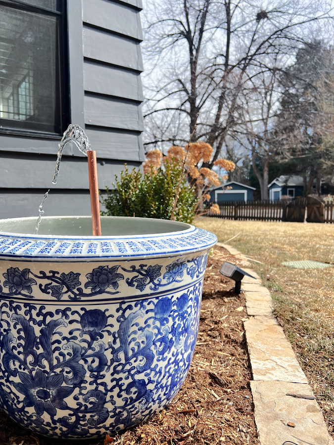 DIY solar fountain in blue and white planter