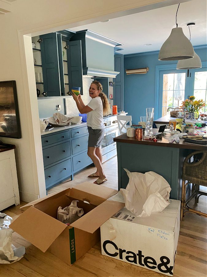 Unpacking in our new blue kitchen!