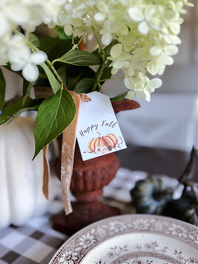 pumpkin gift tag on rusty urn