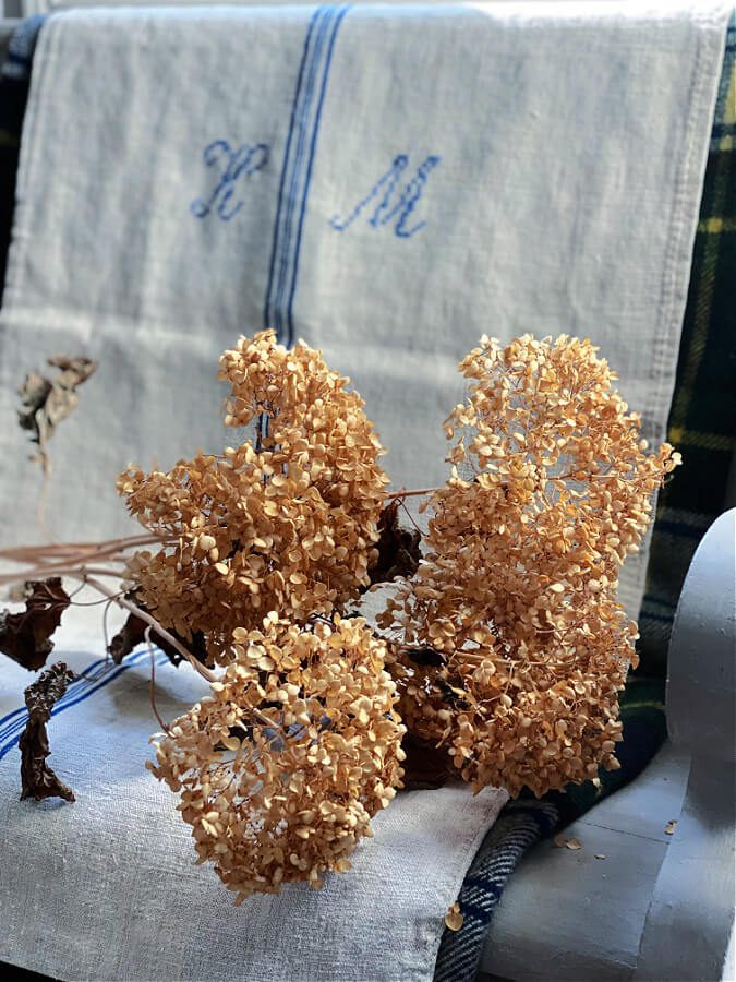 Dried hydrangeas add a natural Fall feel on our pew.