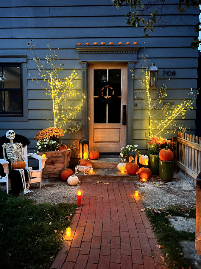 HAlloween front steps lined with votives and candles from the Dollar Store for Halloween decor