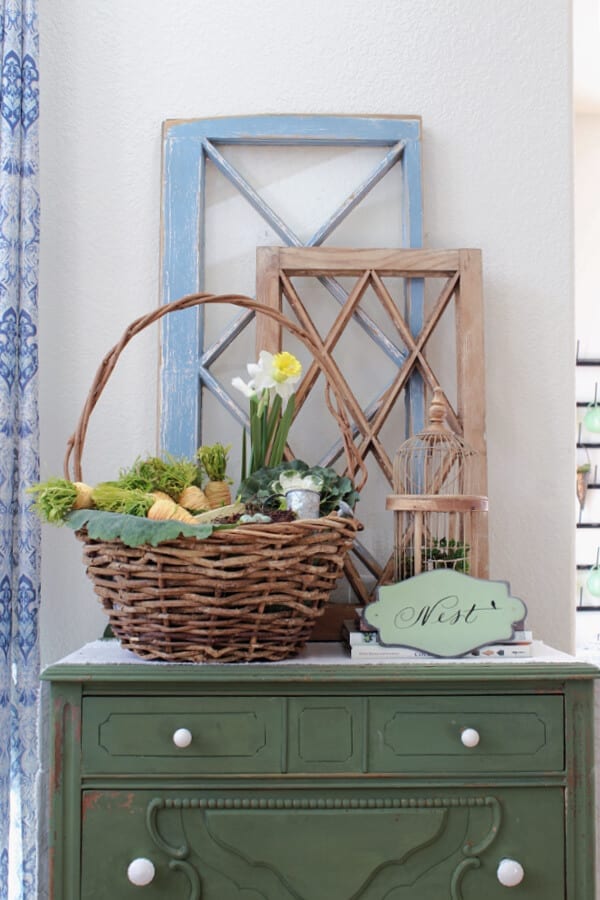 Easter basket and Spring decor make the perfect vignette