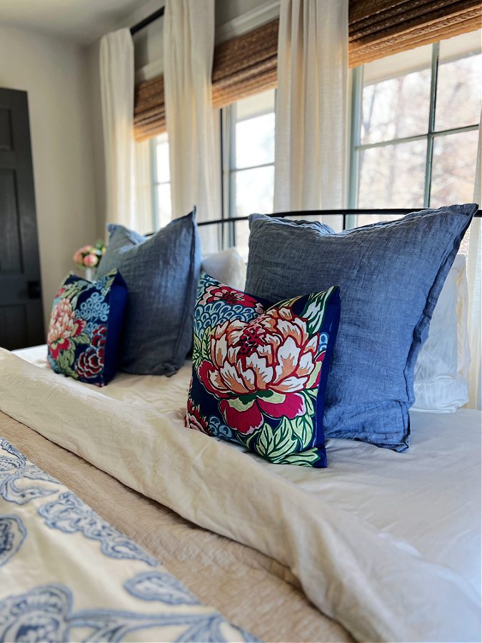 Blue euro shams and floral pillows make our bed ready for Spring!