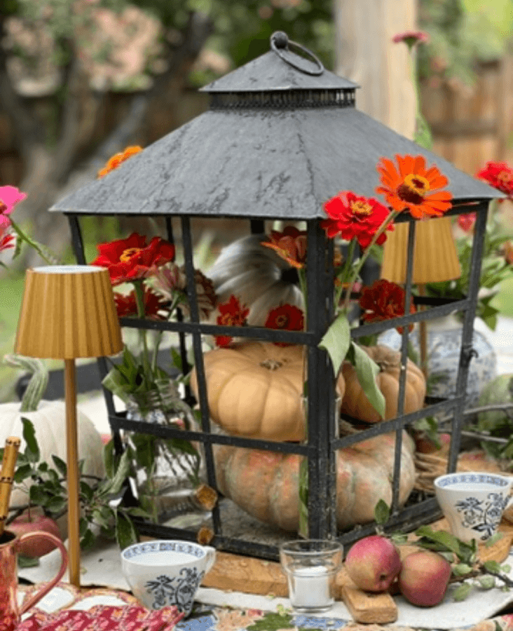 Fall table with flowers and fruit