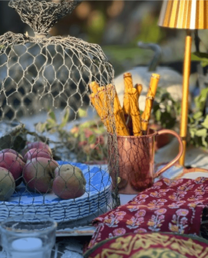 apples under wire cloche