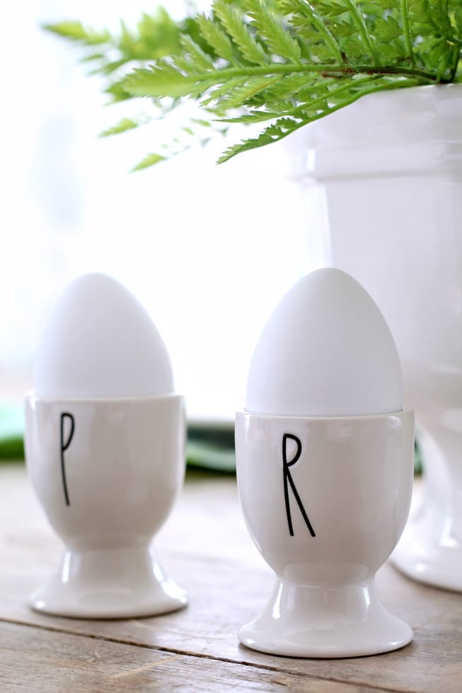 Faux eggs in these egg cups are an easy way to decorate for Easter.