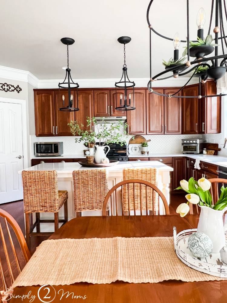 Who says a kitchen with cherry cabinets can’t look modern? We’ve got ideas to update your kitchen with wood cabinets without painting them! Simply2Moms