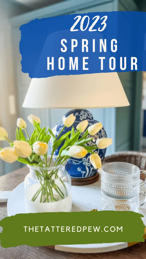 Spring Home Tour 2023 Tulips, blue and white lamp and glasses on white round board in Spring kitchen.