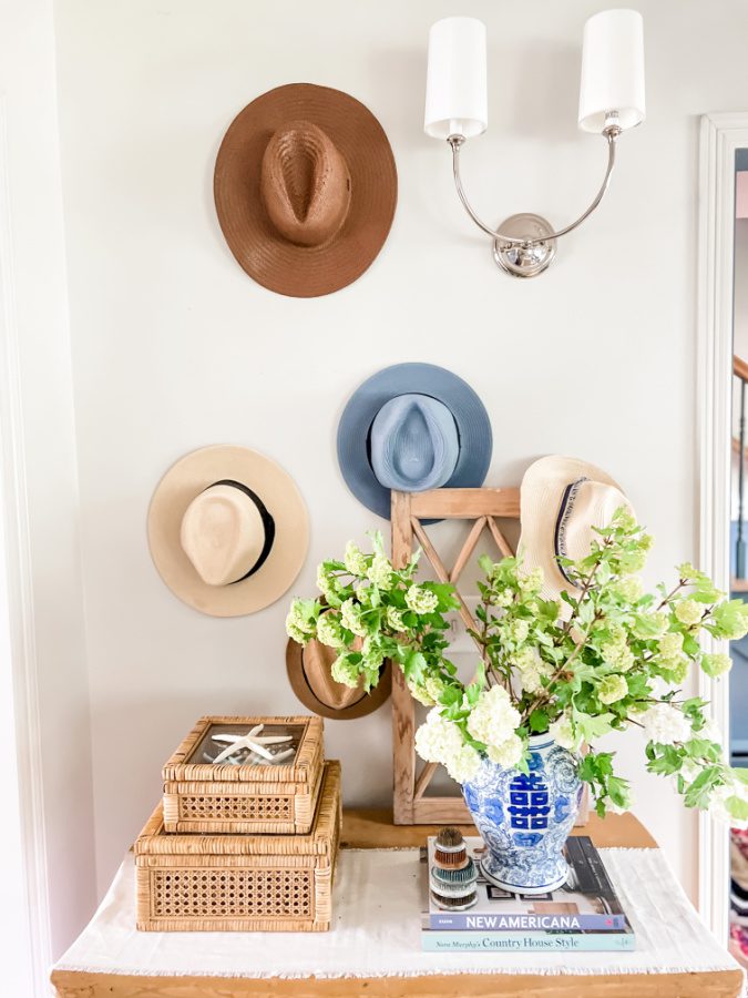 Using hats on the wall and viburnum flowers are jsut a few was I like decorating with blues and greens for summer!