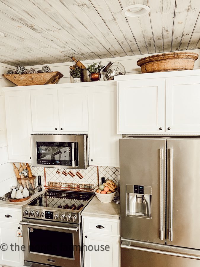 Looking for ideas on how to decorate above kitchen cabinets with a modern farmhouse style?  Rachel shares tips for creative decorating using collectibles and more. The Ponds Farmhouse