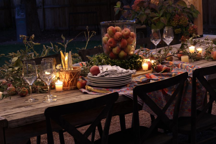 An evening outdoors with a table set for Friendsgiving.