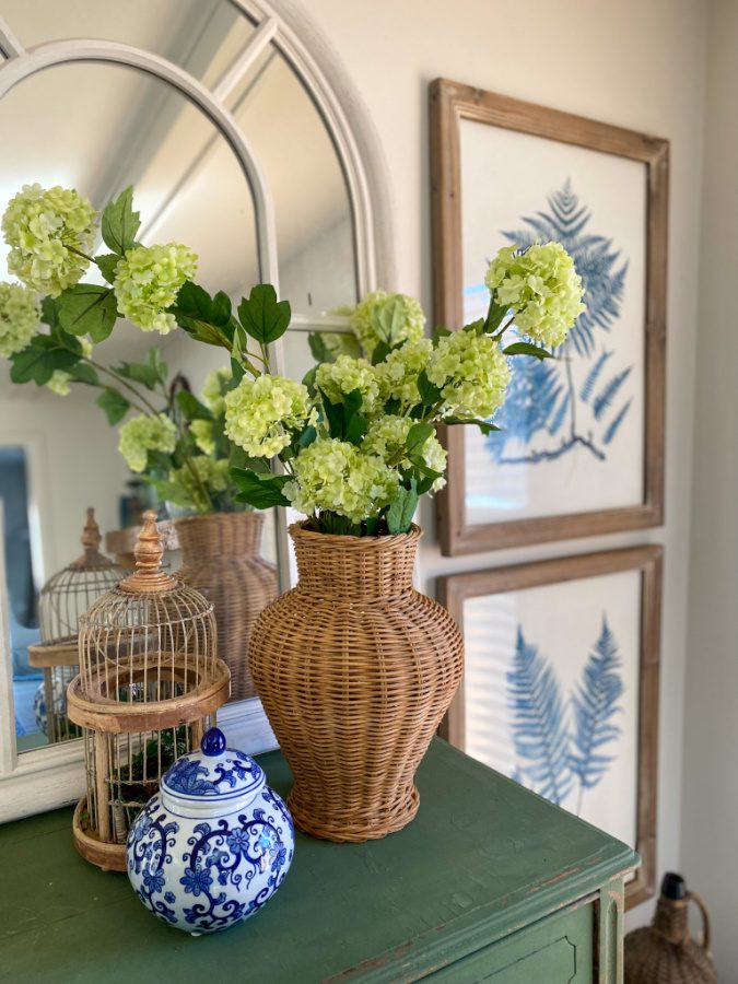 Spring flowers, rattan vase and pops of green. Spring decorating inspiration!