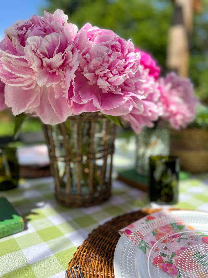 Pink peonies in a wicker vase.