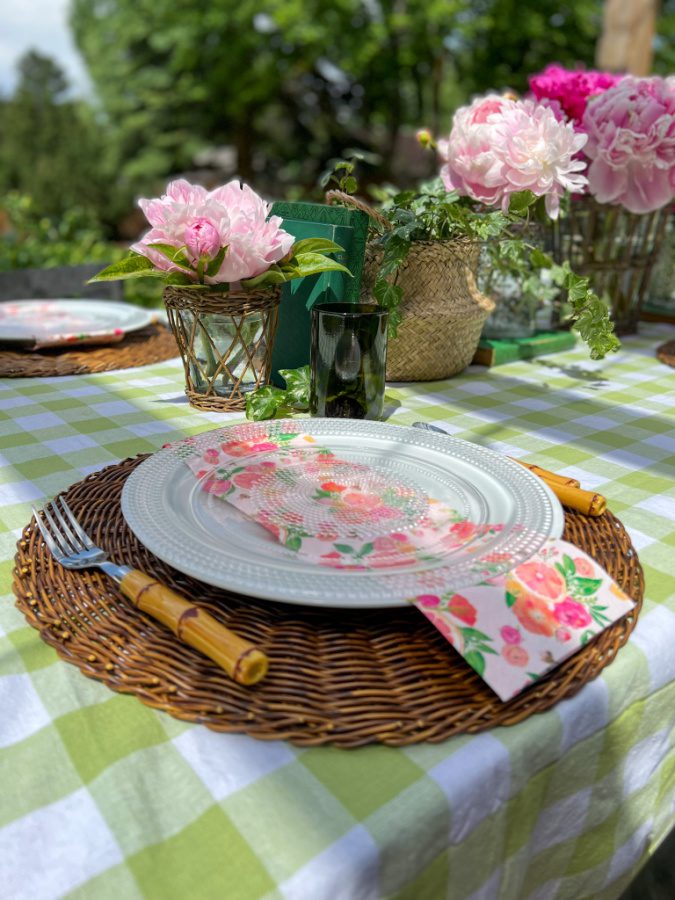 Woven placemats, faux bamboo flatware and paper napkins on our outdoor table.