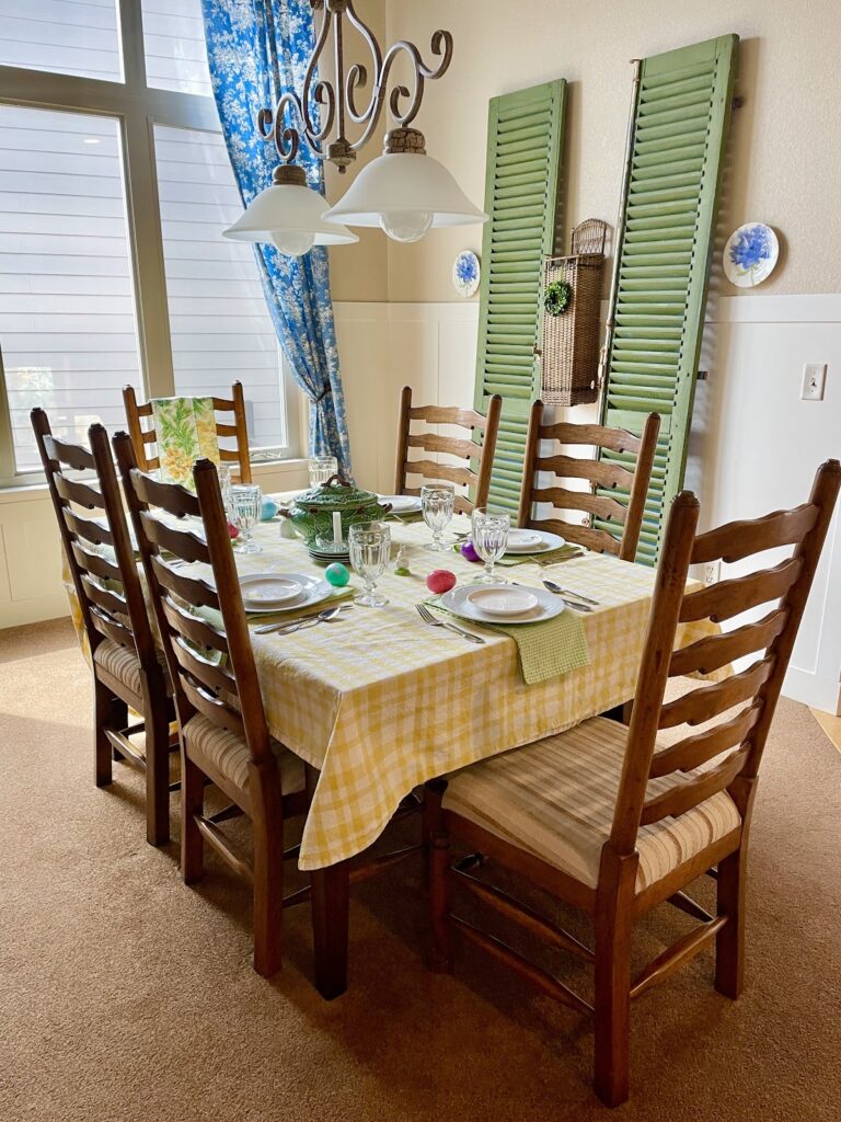 Easter table in dining room with tall green shutters