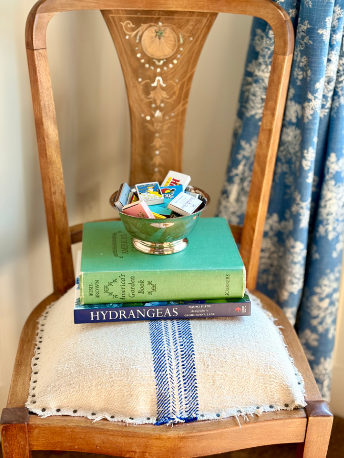 Tuesdays with Tracy chair with books stacked