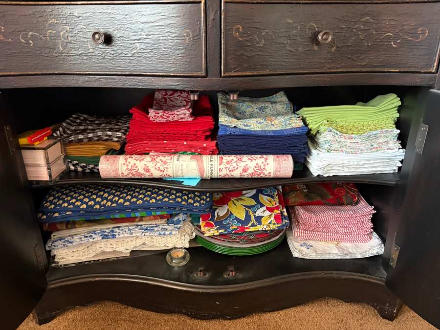 open cabinet of mom's with linens