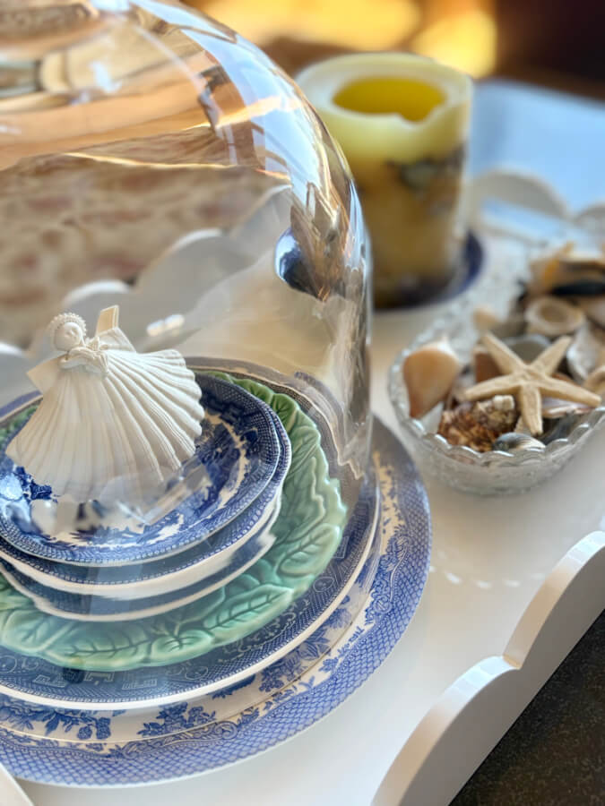 stacked plates with sea shell ornament