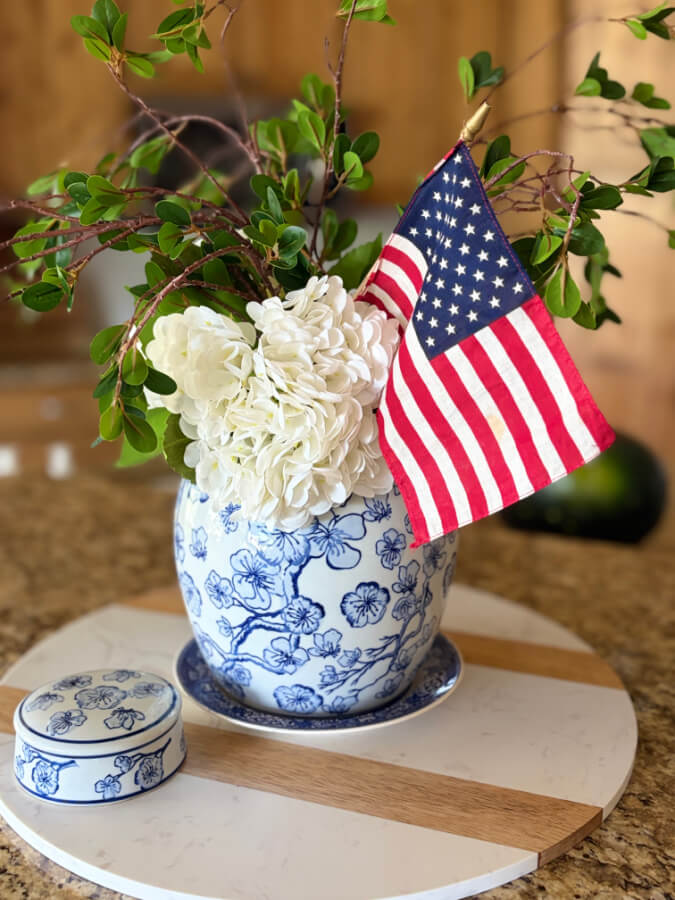 flag in blue and white vase