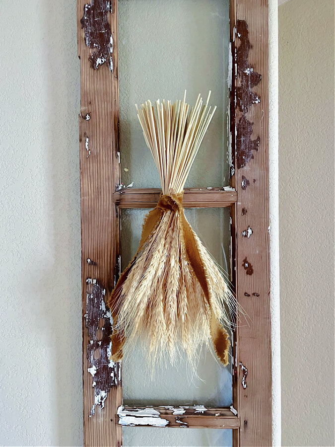 close up of hanging wheat bundle on window