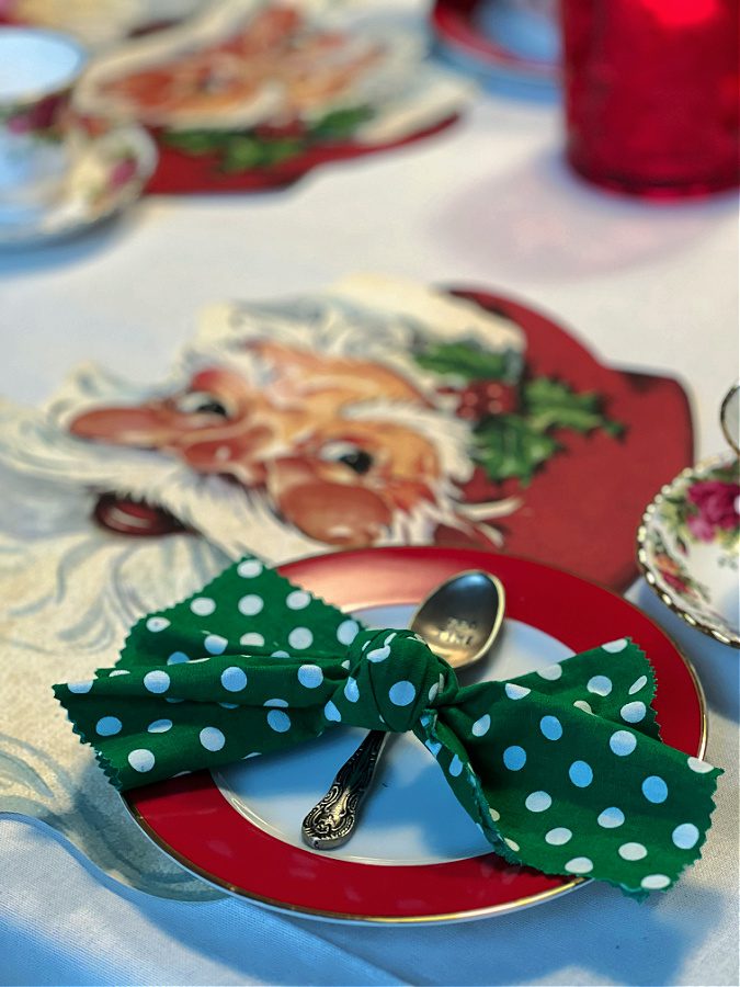 green polka dot napkin with Santa placemat