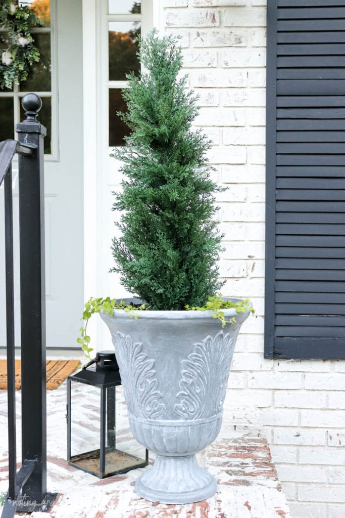 Welcome Home Saturday: Faux Concrete Plater With Paint | Welcome Home Saturday by popular Alabama life and style blog, She Gave It A Go: image of a faux concrete planter with a green evergreen tree in it. 