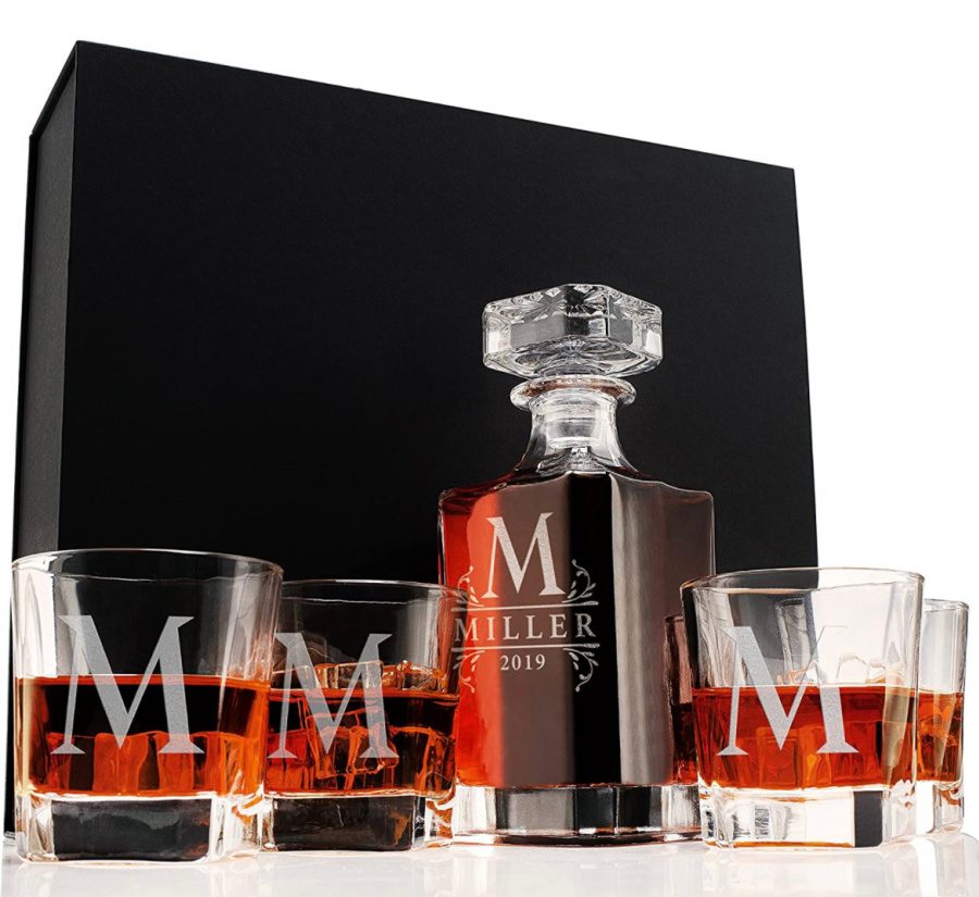 Whiskey decanter glass set in front of a black box