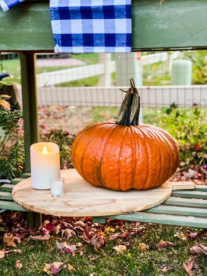 Pumpkins, plaid and candles in the Fall garden.