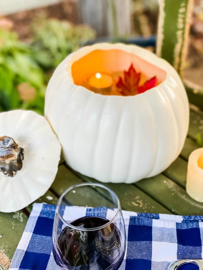 Why not float some candles in a faux pumpkin in your garden?