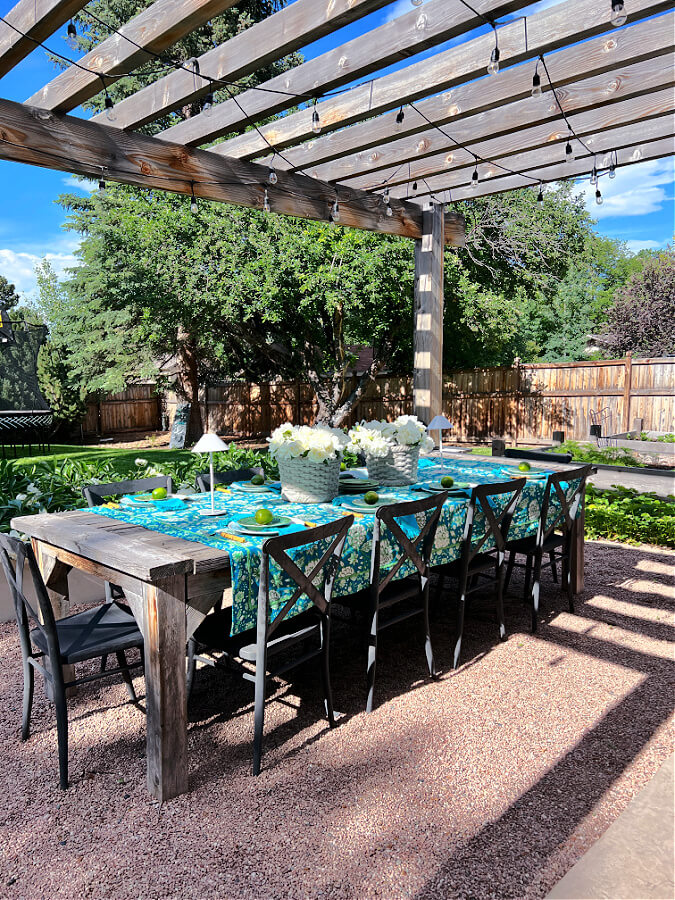 An elegant and tropical outdoor table set for a party