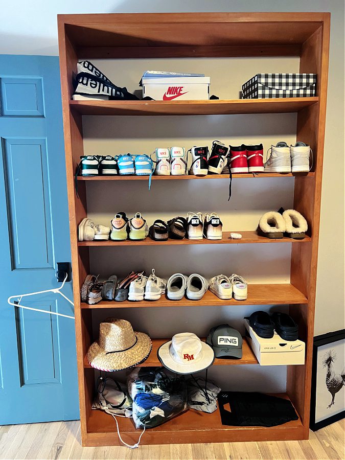 Bedroom shelves with shoes: before