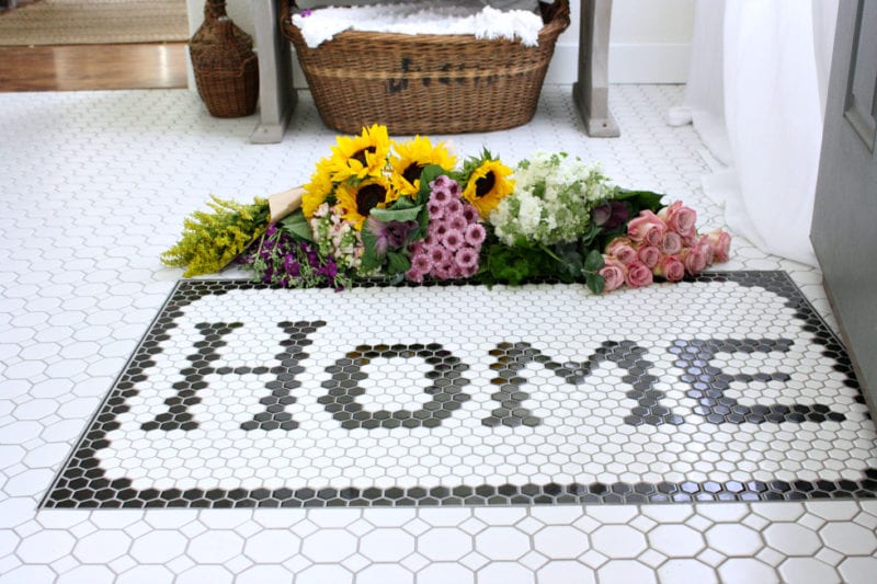 Tiled entryway doormat.