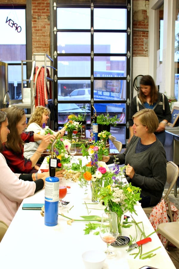 A fun gathering at a local brewery for a floral arrangement workshop.
