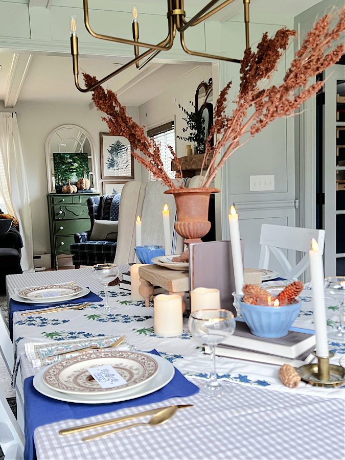 A side view of mismatched Fall tablescape with blues and browns