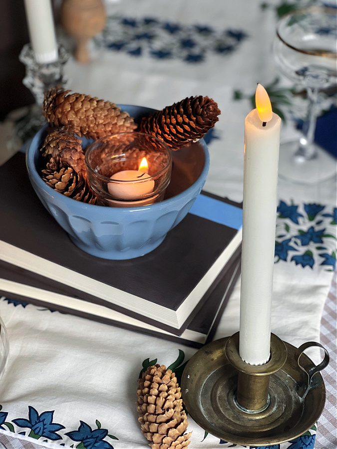 stacked books and candle